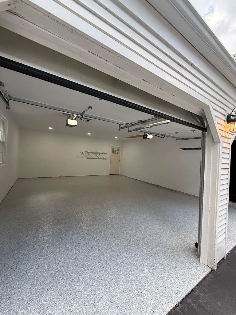 Garage floor coated with a durable flake system