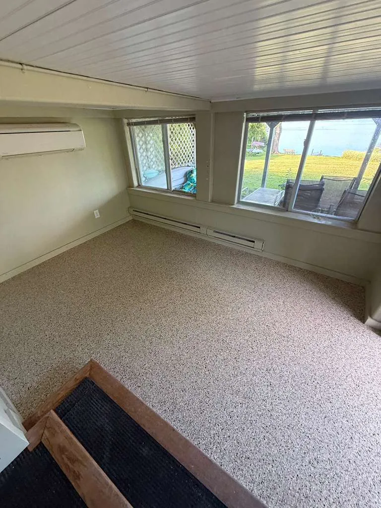 Sunroom floor finished in a warm flake blend
