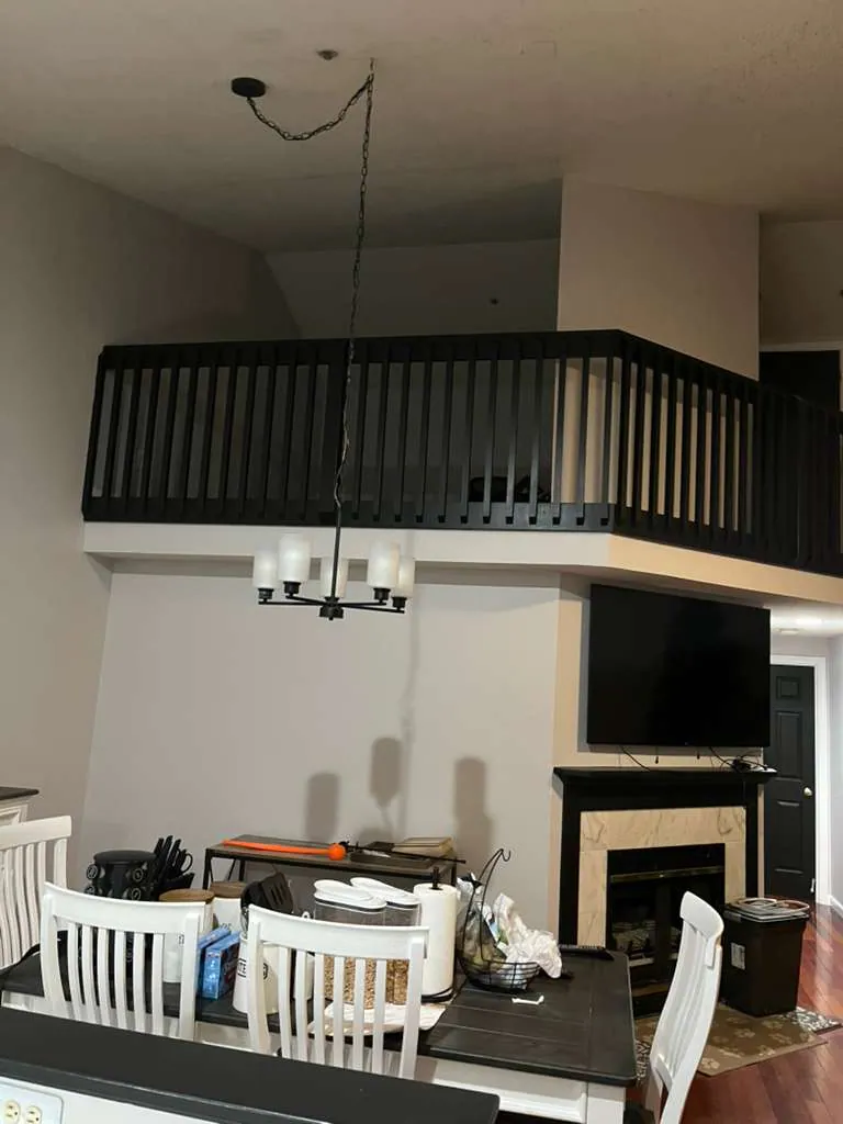 Interior repaint, black loft railing and warm walls