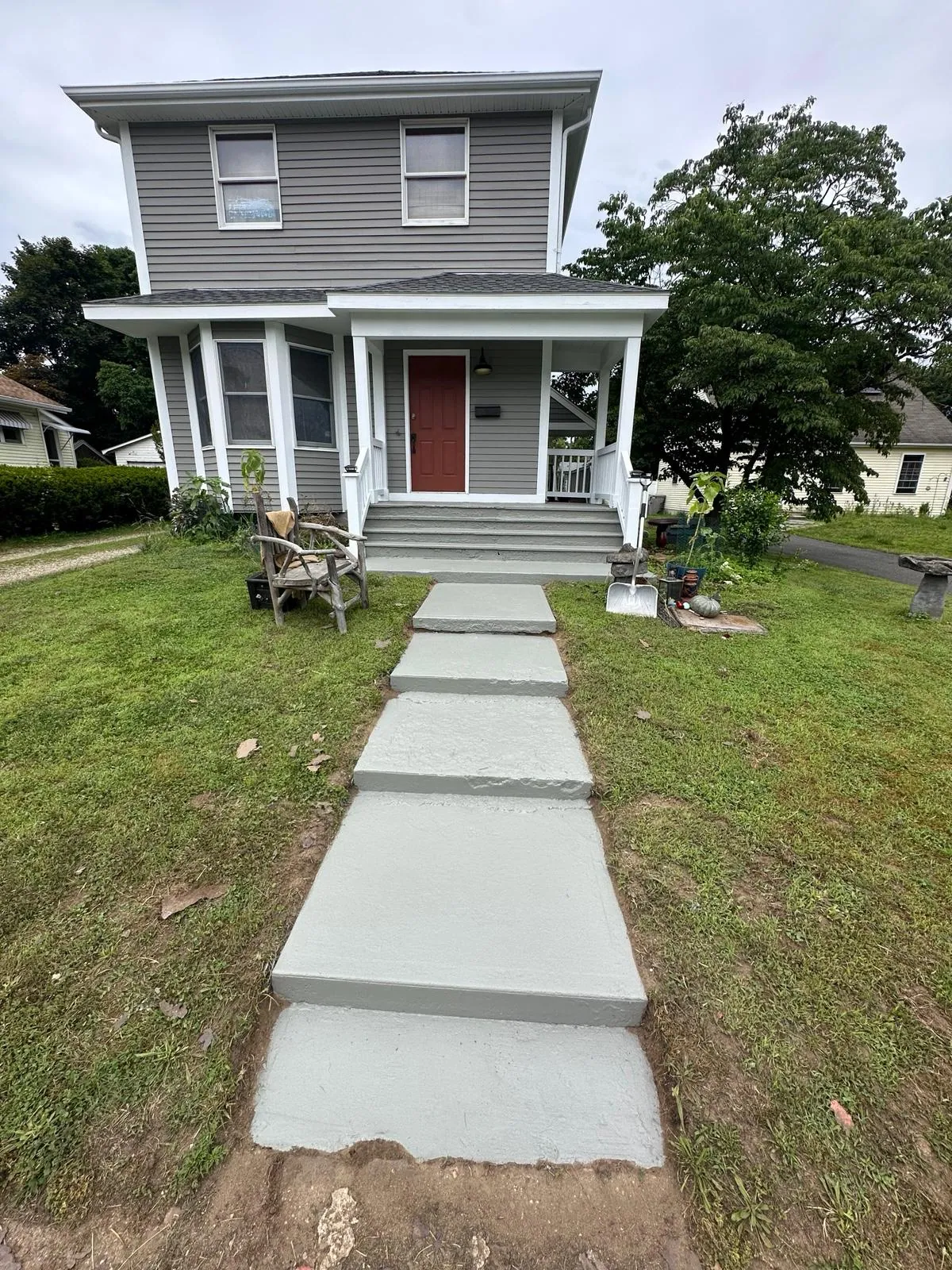 Front elevation repaint, warm gray with white trim