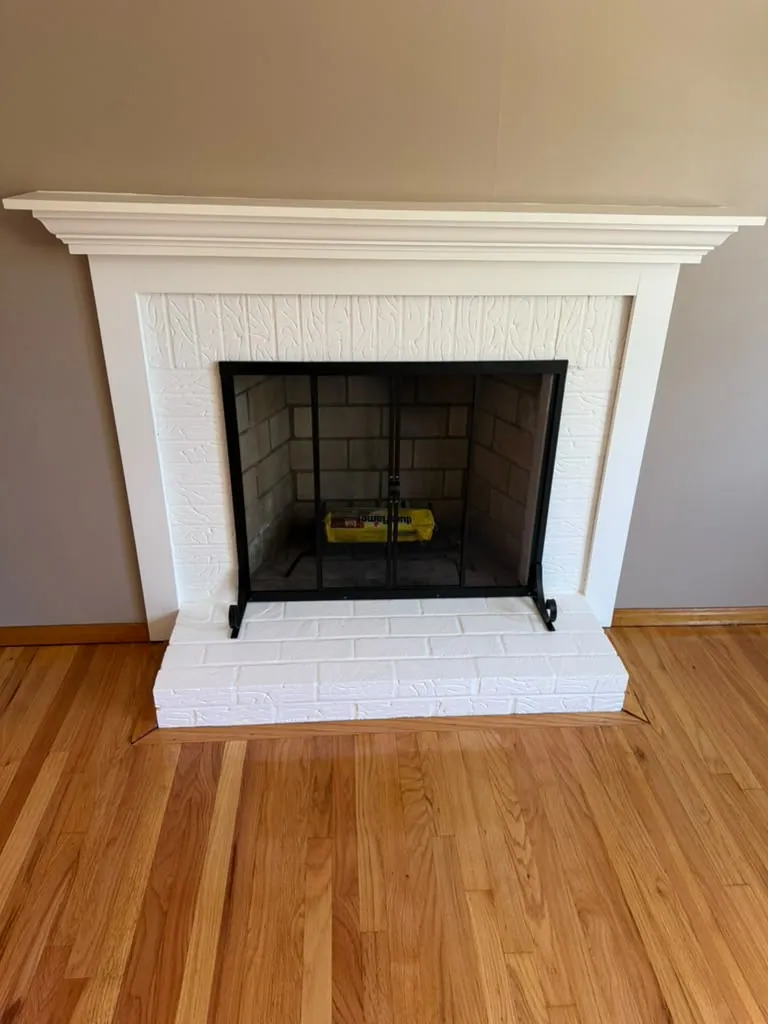Brick fireplace and mantel painted crisp white