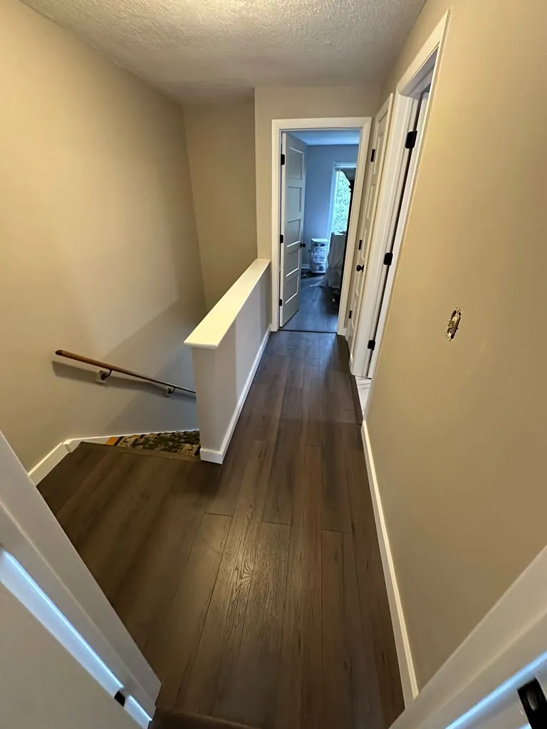 Upstairs landing with fresh white trim and doors