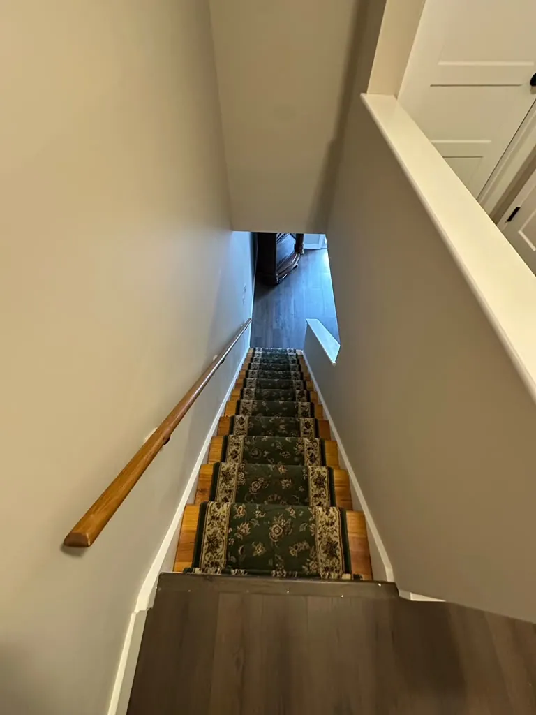 Upper landing and stair walls, sharp trim lines